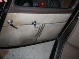 a man opening the door of a car with his hand