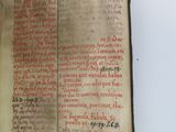 an old book with writing on it sitting on top of a table