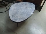 a table that has a marble top on it