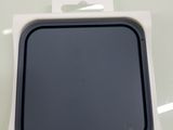 a box with a black lid sitting on top of a white table
