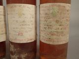 three bottles of wine sitting next to each other on a table