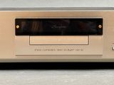 an image of a tan stereo player with a remote control