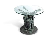 an image of a glass table with a statue on it
