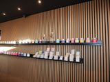 a wall with shelves filled with different types of candles