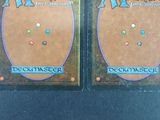 two cards that are sitting on a table