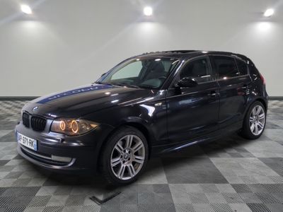 a picture of a black bmw suv parked in a garage