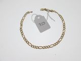a close up of a chain bracelet with a price tag on it