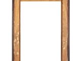 an old wooden picture frame hanging on a white wall