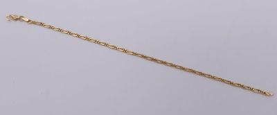 a close up of a gold chain on a white background