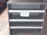 a shelf that has a sign on it in a store