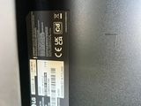 the back of a computer monitor with a sticker on it ' s side