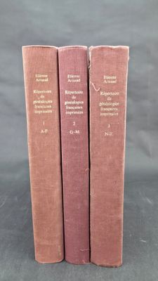 three books are stacked on top of each other on a table