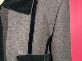 a close up of a jacket and tie on a mannequin mannequin