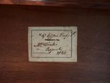 a label on a piece of paper on a table