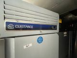a picture of a refrigerator with a sign on it