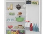 an open refrigerator with a lot of food inside of it