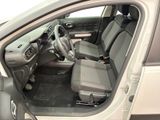 the interior of a car with the door open and the driver ' s seat down