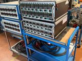 a blue cart with a bunch of electronics on top of it