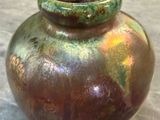 a vase that is sitting on a table in a room