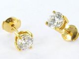pair of diamond stud earrings on a white background