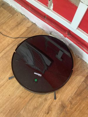 an image of a roombake on the floor in front of a red wall