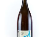 the bottle of wine is empty on a white surface