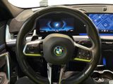steering wheel and dashboard of a bmw concept car on display at a car show
