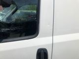a man that is sitting in the driver seat of a van