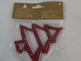 three pieces of red glittered hair clips on a white surface