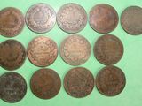 a close up of a bunch of coins on a green surface