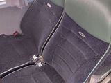 two black seats in the back of a van