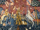 a tapestry with a picture of a man and animals on it