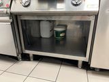 a silver stove with a bucket of coffee in it