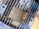 a close up of a blue electric motor on a table