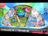 une boîte de cartes Pokémon sur laquelle figure un personnage bleu et vert