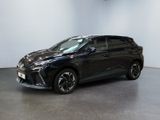 a black toyota c - hr suv parked in a showroom