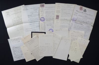 a pile of old letters on a black table