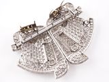 an image of a silver brooch with diamonds on a white background