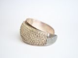 a close up of a ring on a white surface