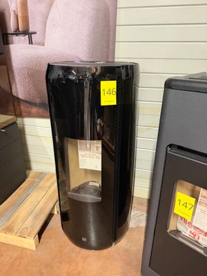a black water heater sitting next to a black stove