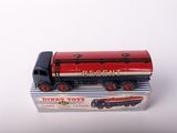 a red and black toy train on a white surface