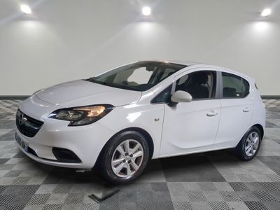 a picture of a white car parked in a garage
