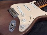 a close up of an electric guitar with a guitar pick up