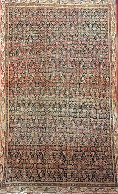 an antique persian rug with a red border and a floral design