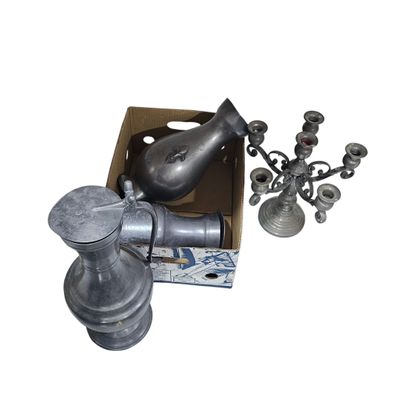 a box that has a candle holder and a candelabra in it