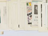 a lot of papers hanging on the wall next to each other