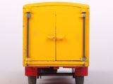 a toy truck with a yellow door on the back of it