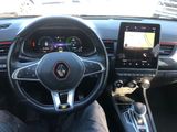 a picture of a car dashboard with a steering wheel and a touch screen