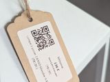 a small white table with a tag on it