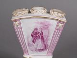 a vase with a picture of a man and a woman on it
